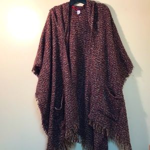 Lovely multi-color poncho with hood and pockets - one size fits most.